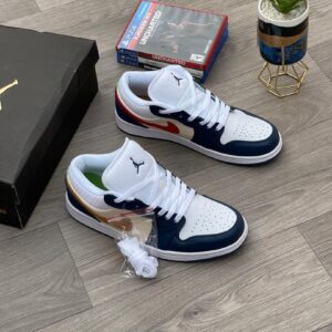 A pair of white, navy, and gold Air Jordan 1 Mid SE sneakers on a wooden floor, exuding luxury and high-class style.