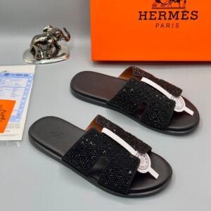 Luxury black slide sandals with rhinestone straps and a sleek design, presented with an Hermes Paris box and packaging, available at Levonteluxe in Nigeria.