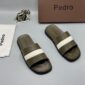 Luxury Pedro slides with brown, navy blue, and white straps, presented with a brown box and silver elephant figurine on a grey background | Levonteluxe