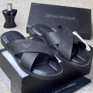 A pair of luxurious black Emporio Armani slides in their box, exuding opulence and refinement.